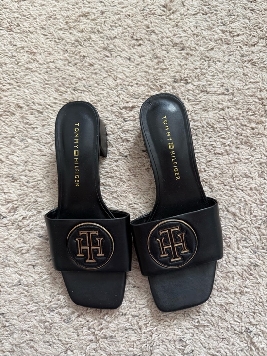 Tommy Hilfiger Shoes - Tommy Hilfiger Black Slip-On Mules with Gold Logo Medallion